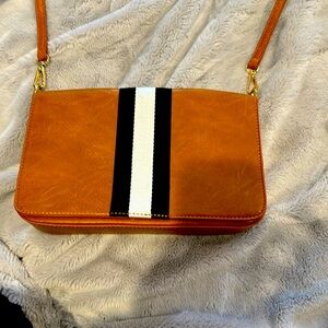 Cross body or clutch. Vegan leather. Awesome condition. Removable strap